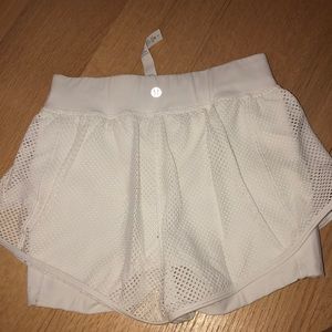 White mesh lined Lululemon shorts size 2
